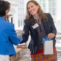 Erica Hamilton shaking hands